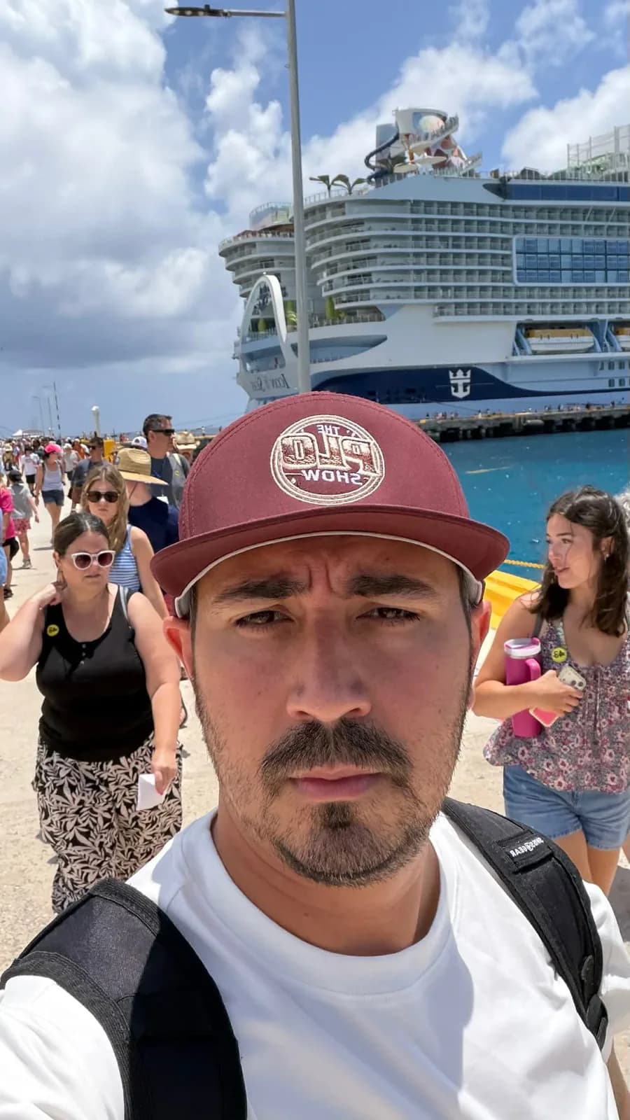 PLO Show fan in the maroon snapback at the cruise port