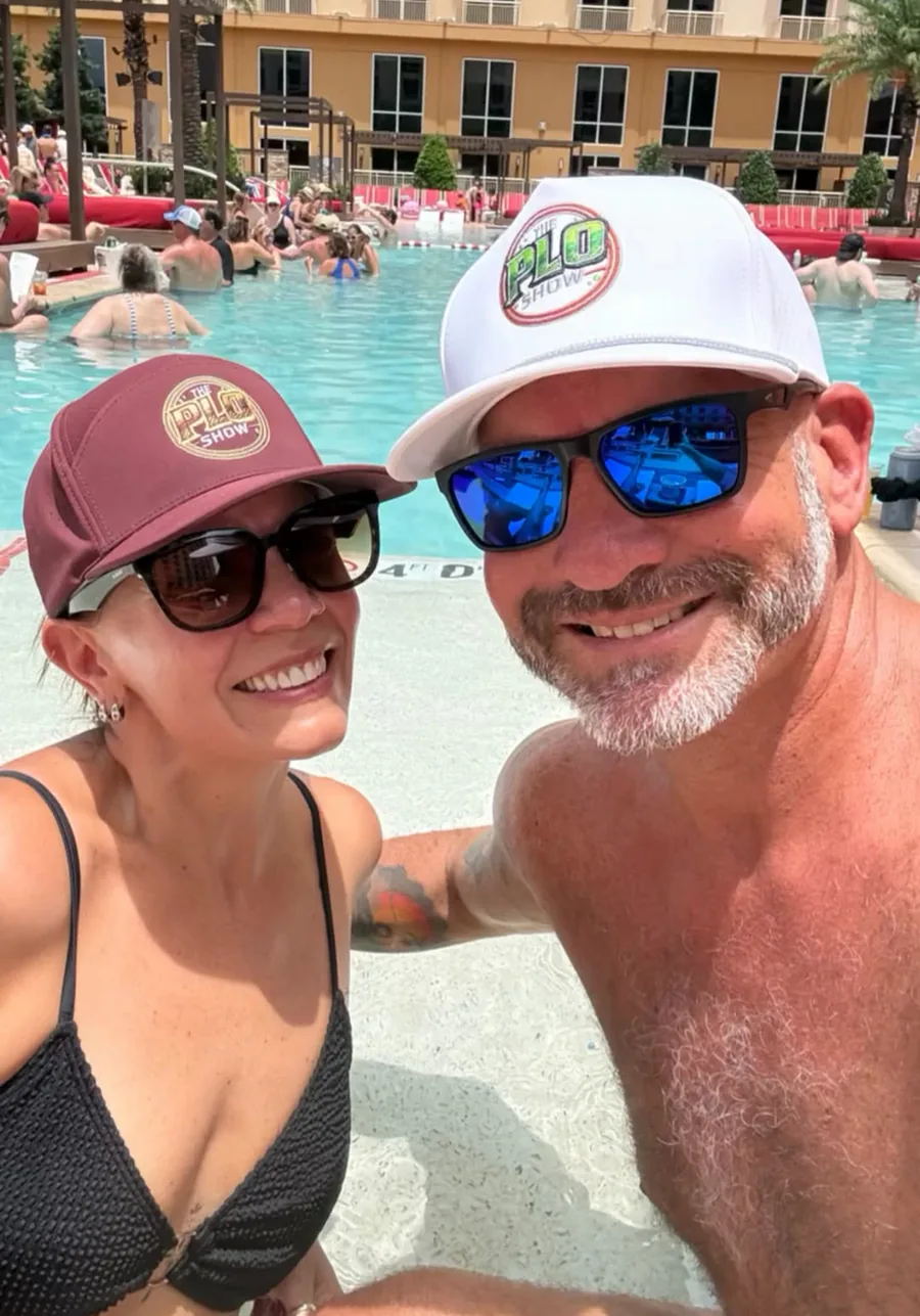 Two PLO Show fans in the maroon and white hats poolside in Las Vegas